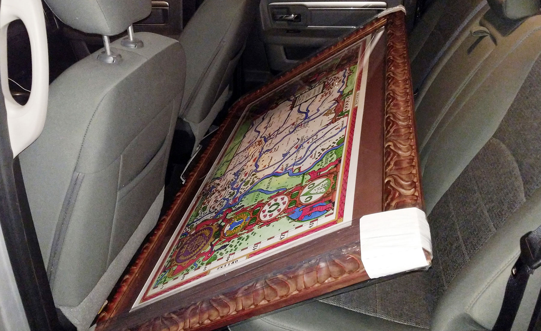 Fit of the framed map in the back row of the truck